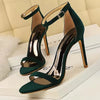 Buckle secured suede heels with modern hollow detailing