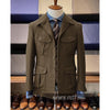 Vintage tweed herringbone men's blazer with four pockets, notched collar, and single-breasted design for stylish occasions.