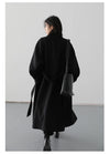 Sophisticated wool blend outerwear featuring belted waist and long length