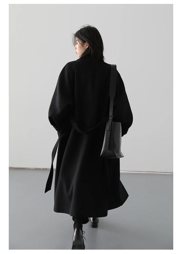 Sophisticated wool blend outerwear featuring belted waist and long length