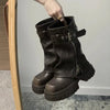 Chic women's mid-calf biker boots with buckle detail, cozy plush lining, and durable rubber sole for stylish winter wear.
