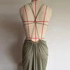 Sunset Escape dress showcasing elegant backless design with waist-defining cutouts