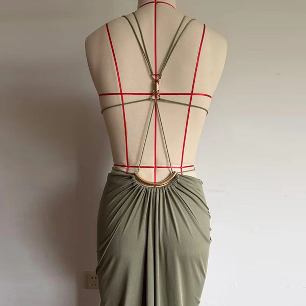 Sunset Escape dress showcasing elegant backless design with waist-defining cutouts