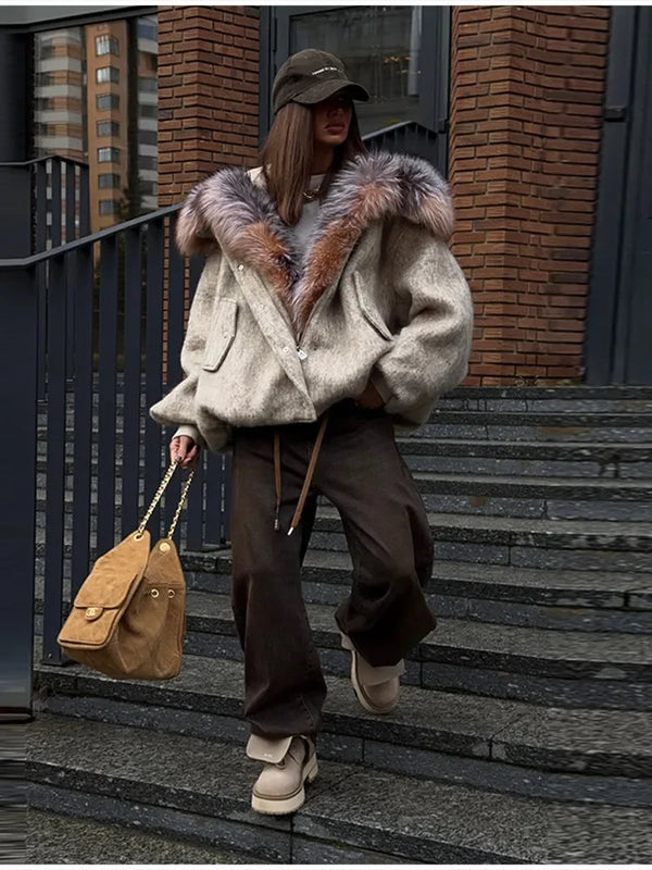 Back view of oversized plush hooded jacket showing relaxed drape