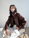 Detail of the tailored fit of the vintage leather cropped jacket for women.