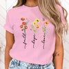 Floral print women's tee featuring 'Faith Hope Love' message, perfect for casual wear and versatile styling options.