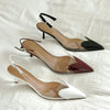 Clear PVC pumps with pointed toe and adjustable buckle strap on white background