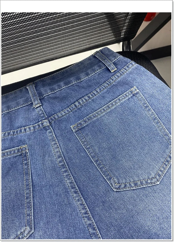 Vintage-style denim shorts showcasing fringe hem and strategic distressed accents
