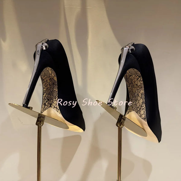 Black leather stiletto pumps with eye-catching crystal embellishments.