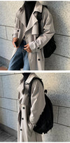 Men's long double-breasted trench coat with turn-down collar, perfect for autumn and winter streetwear and casual style.