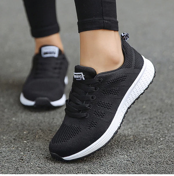 Lightweight white workout shoes featuring playful colorful details