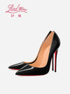 Side view of sleek black pointed-toe pumps with dramatic stiletto heel