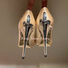 Close-up of luxury crystal inlays on elegant stiletto pumps.