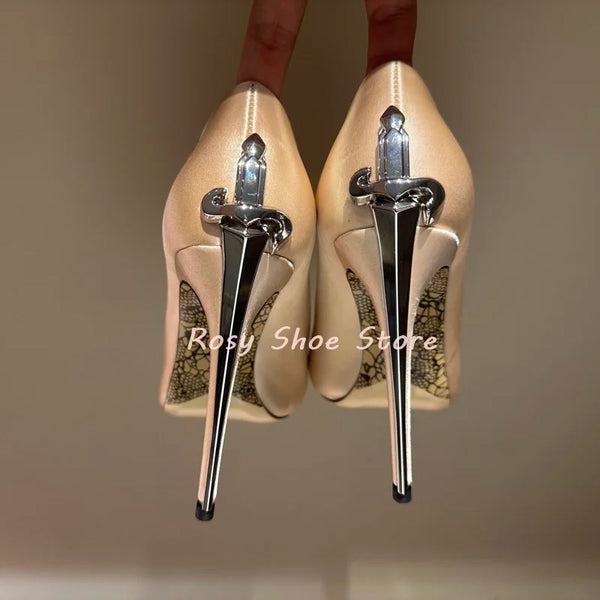 Close-up of luxury crystal inlays on elegant stiletto pumps.