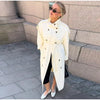 Neutral cream trench coat with classic collar and adjustable tie belt feature