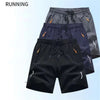 Secure zipper pocket detail on men's quick-dry athletic shorts