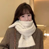 Elegant winter scarf draped over a stylish outfit, highlighting its versatility for casual and formal wear.