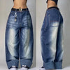 Quality blue jeans with relaxed fit and vibrant street art embroidery.