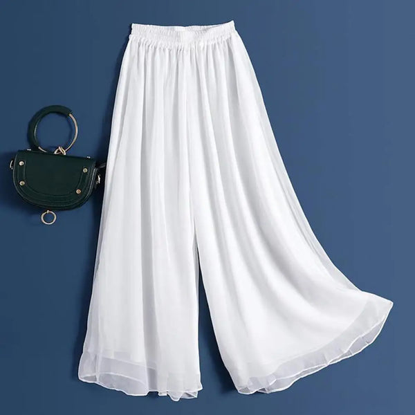 Elegant pleated swing pants in navy, featuring a flowing design perfect for casual or formal wear.
