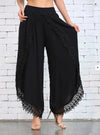 Chic summer harem pants with tassel detail, lightweight, relaxed fit, ankle-length, perfect for casual outings and beach wear