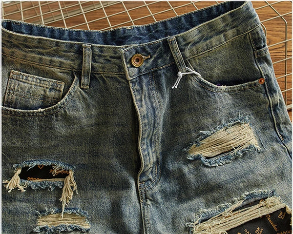 Rebel Spirit Distressed Jeans worn with a graphic tee, showcasing casual denim style.