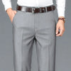 Detail shot showing high-waist design and tailored look of trousers