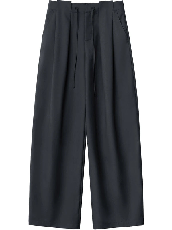 Flowing wide leg trousers with elegant pleating and customizable drawstring waist for perfect fit