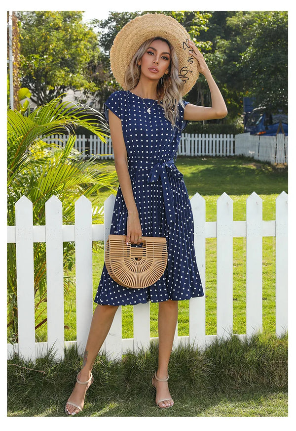 Close up of sash belt detail on high waist polka dot dress