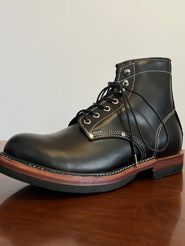 Handmade cowhide leather boots with Goodyear stitching in rich brown color.