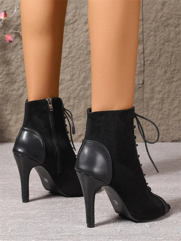 Stage-ready boots with cross-tied straps and quick-change side zipper for performers