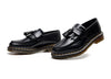 Black tassel loafers featuring a stylish and breathable design.