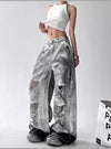 Trendy high-waist wide-leg ripped jeans for women with tie-dye and distressed detailing, perfect for casual street style.