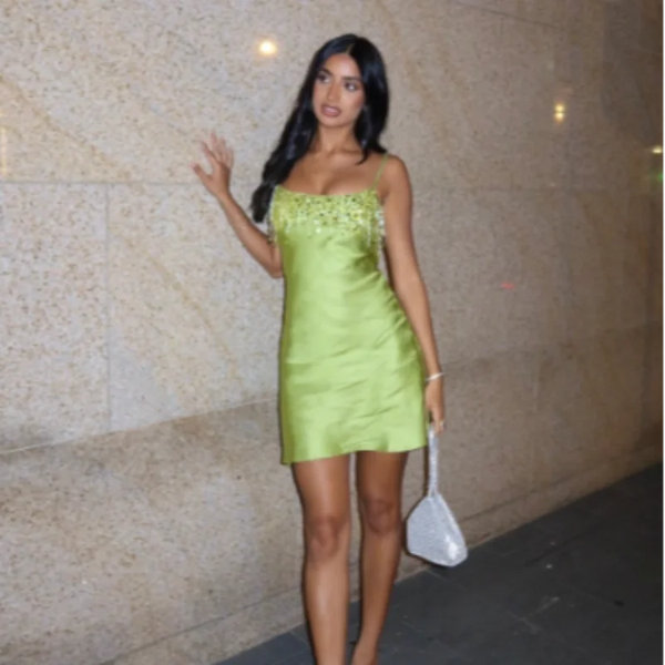 Eye-catching emerald sequin dress with bohemian tassel details and back zipper