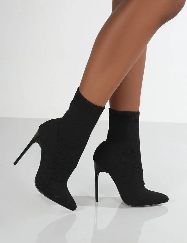 Ankle-hugging knit boots with super high heel and seamless slip-on construction