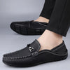 Versatile tan loafers for men, crafted from high-quality genuine leather.