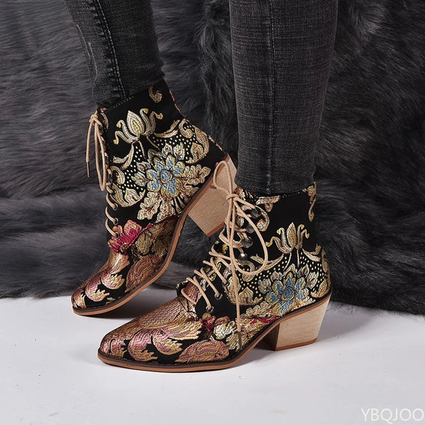 Golden Bloom embroidered ankle boots with floral details and block heel on white background