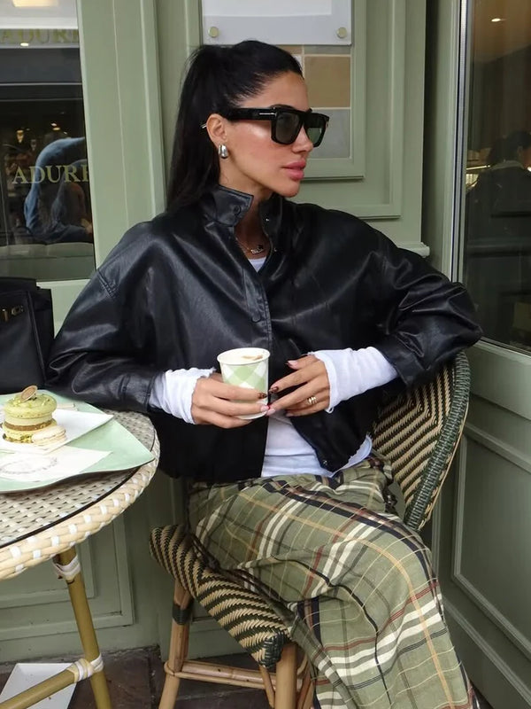 Chic faux leather bomber jacket for women, perfect for autumn fashion and versatile layering with a stylish turtleneck collar