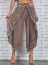 Chic summer harem pants with tassel detail, lightweight, relaxed fit, ankle-length, perfect for casual outings and festivals.