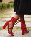 Elegant black stiletto heels with ankle-wrap and super high stilettos.