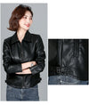 Chic women's sheepskin leather jacket with zippered front, turn-down collar, and pockets for stylish autumn layering.