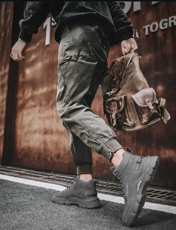 Winter Vanguard boots displayed on a wooden surface, showcasing craftsmanship.