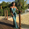 Elegant backless dress with halter straps and curve-accentuating waist cutouts