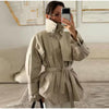 Tailored khaki trench coat with flattering waistline and classic button details