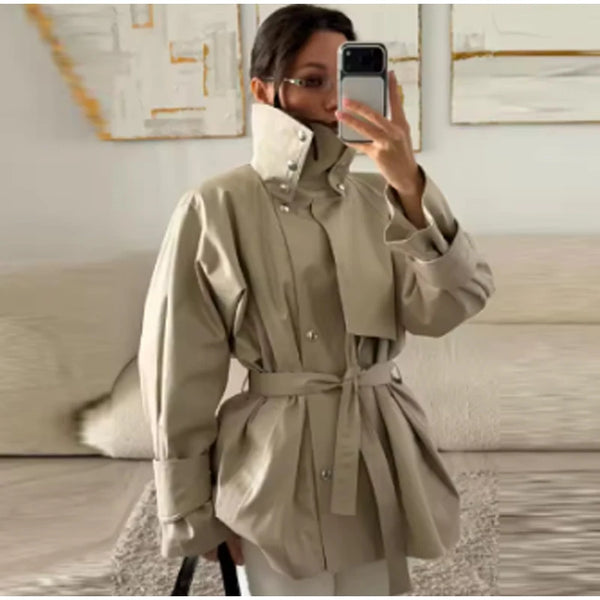Tailored khaki trench coat with flattering waistline and classic button details