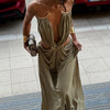 Curve-flattering halter dress with daring backless cut and side waist openings