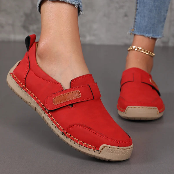 Detail shot of buckle accent and quality leather craftsmanship on slip-on loafers