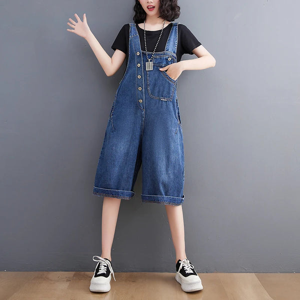 Baggy denim jumpsuit featuring adjustable suspenders and high waist design for effortless spring fashion