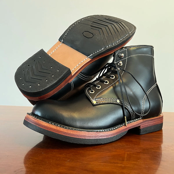 Ankle height of retro style boots with thick rubber sole.