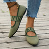 Detail of soft knitted fabric and mixed-color pattern on elegant pointed toe flats