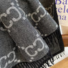 Lightweight cashmere shawl draped elegantly over shoulders, perfect for winter outings.